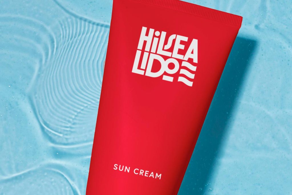 Hilsea Lido branding concept featuring red sun cream packaging against a blue water background
